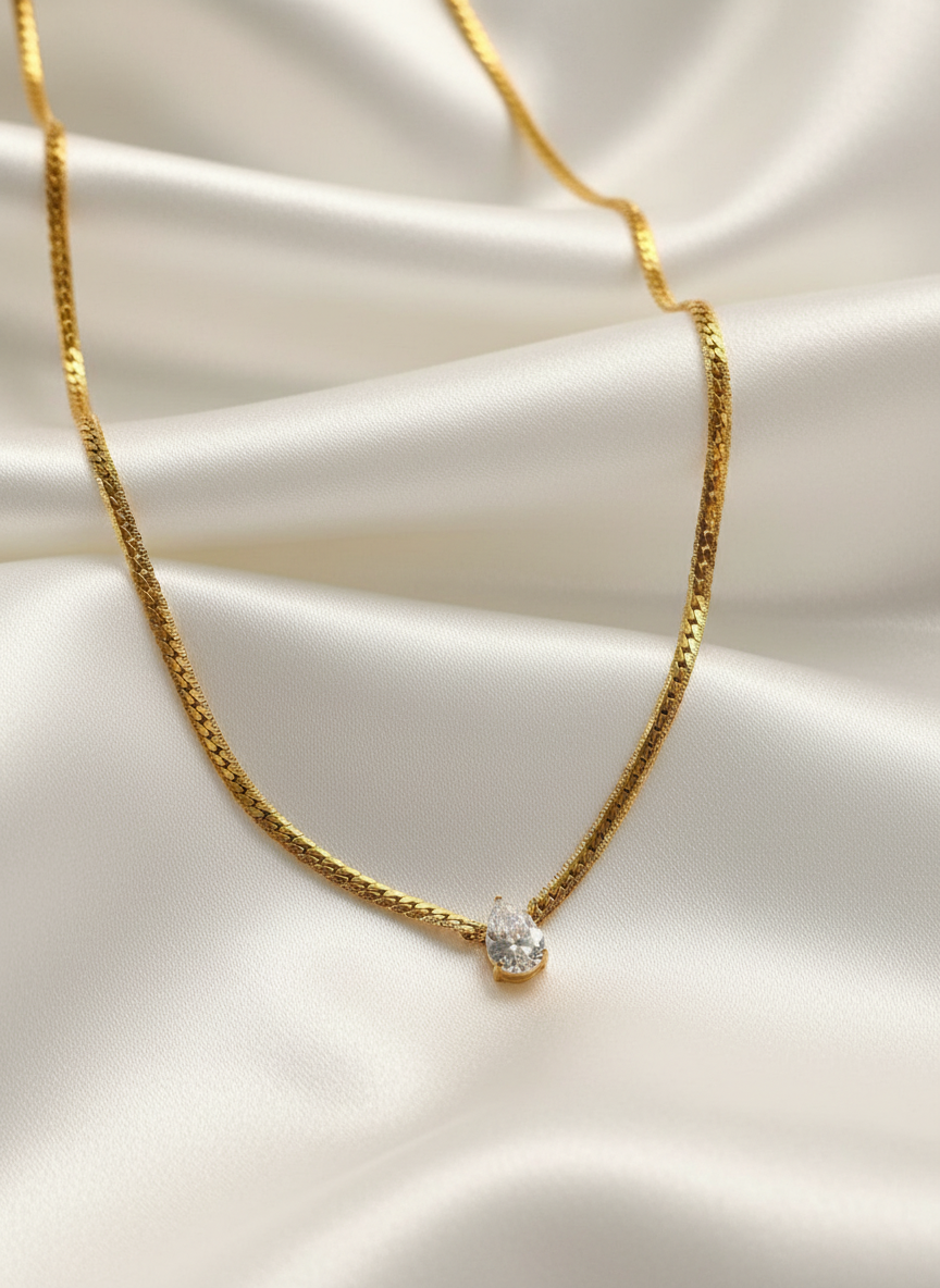 18 Karate Gold - Plated Rope Chain with a Dazzling Teardrop Shaped Center Piece