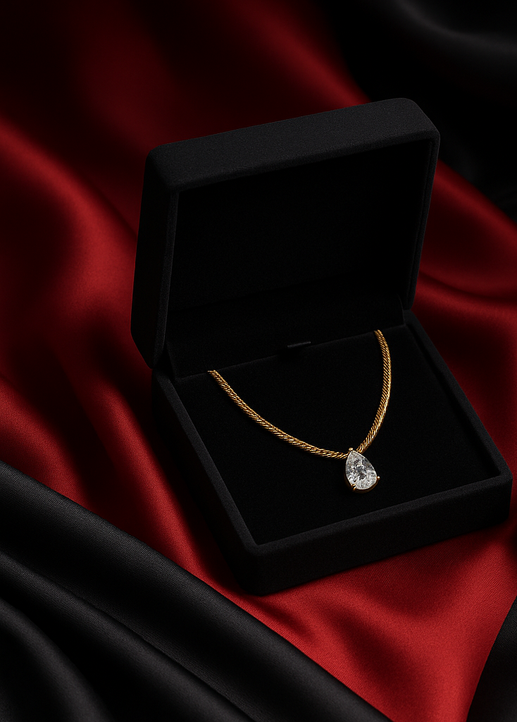 18 Karate Gold - Plated Rope Chain with a Dazzling Teardrop Shaped Center Piece